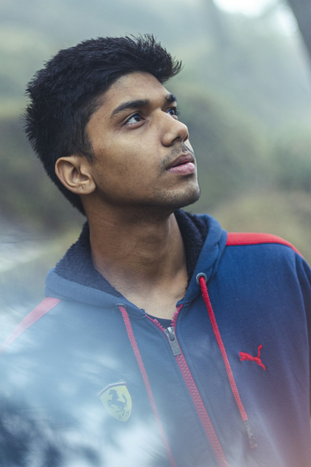 man in blue and red zip up hoodie