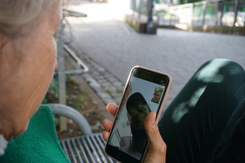 person holding white samsung android smartphone