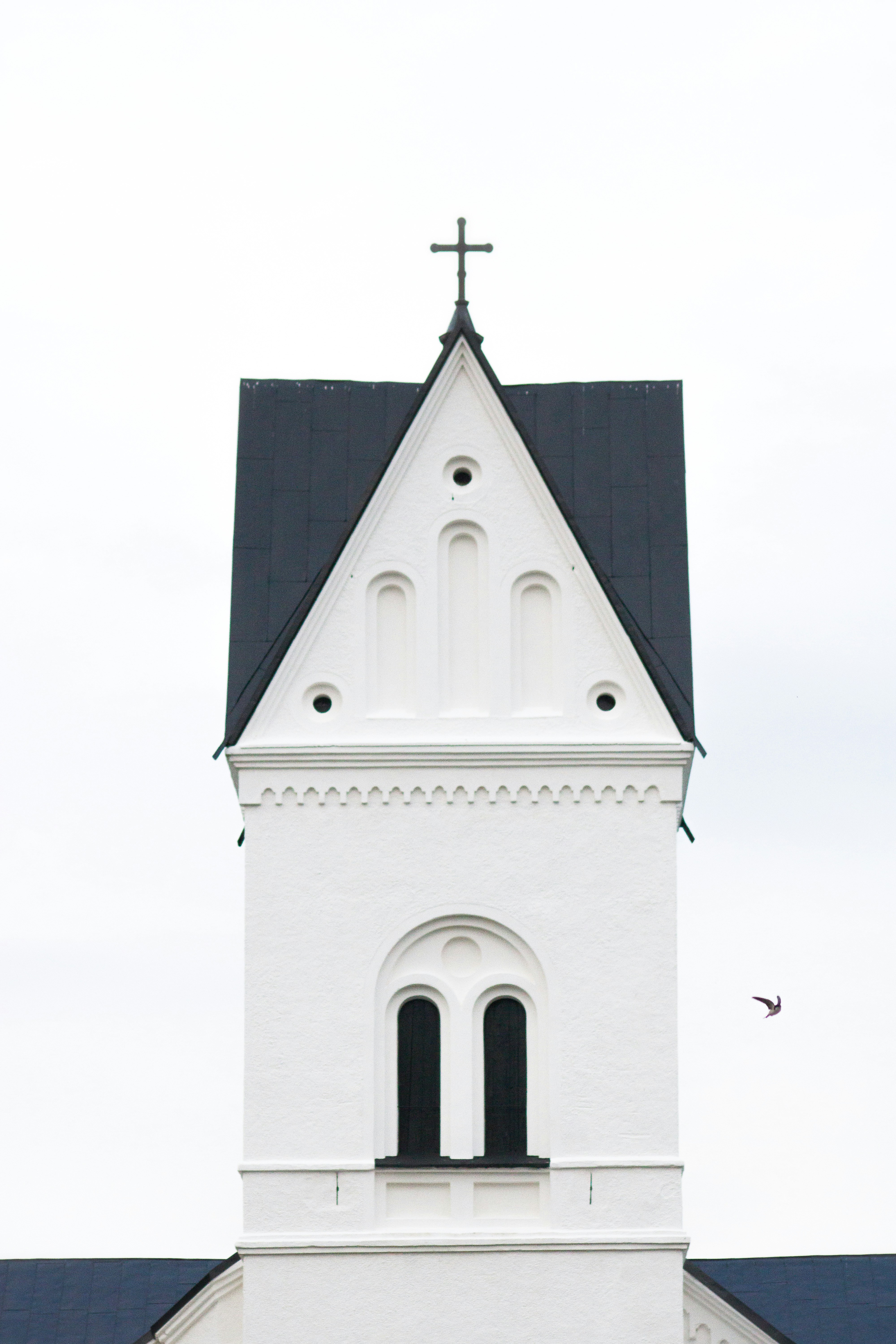 white and black church under white sky during daytime