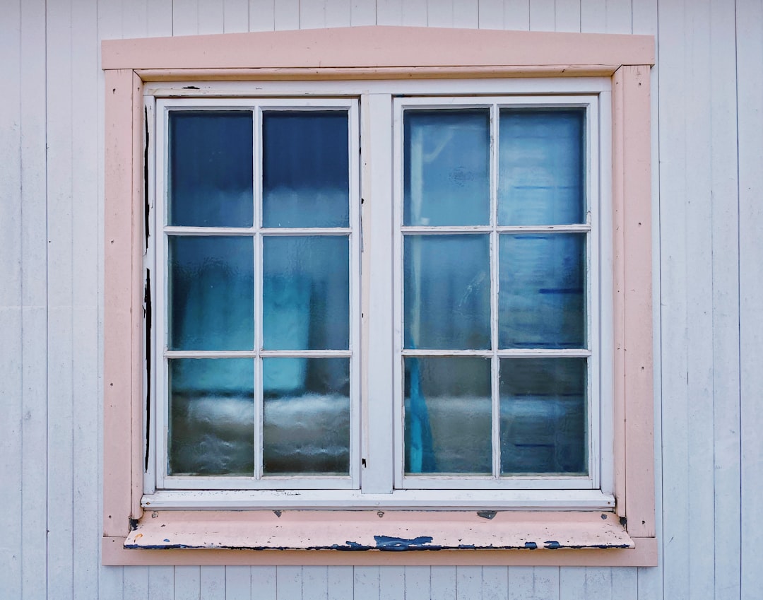 white wooden framed glass window,