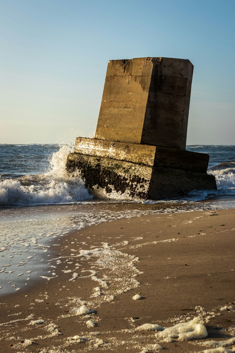 gray concrete building on sea shore during daytime