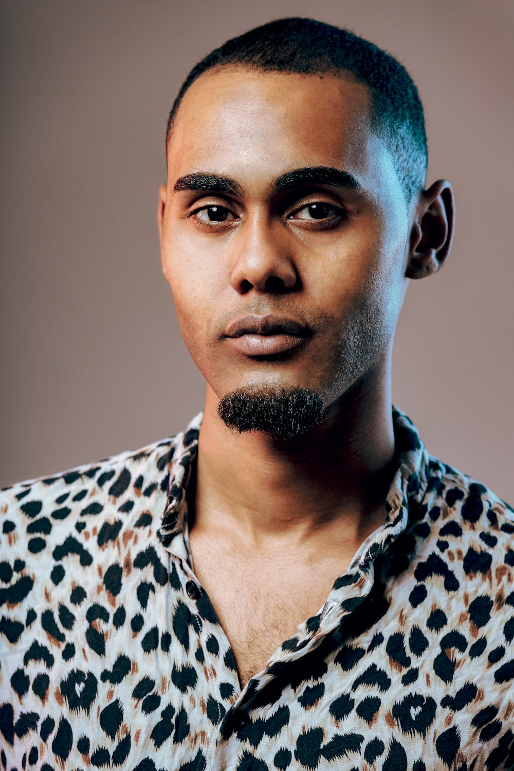 man in black and white leopard print shirt