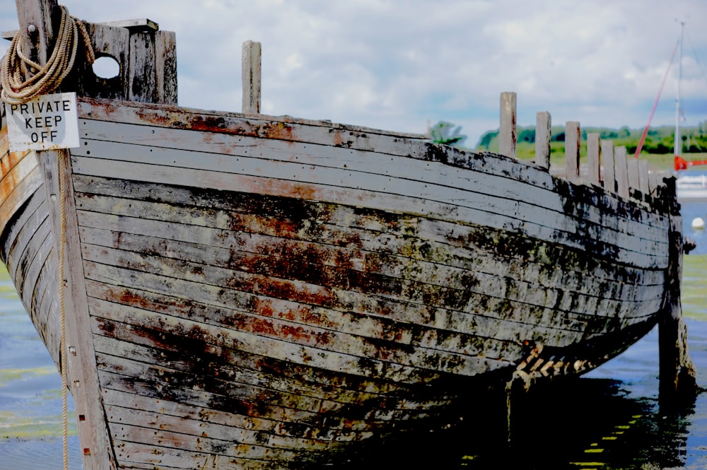 brown and white ship on water during daytime