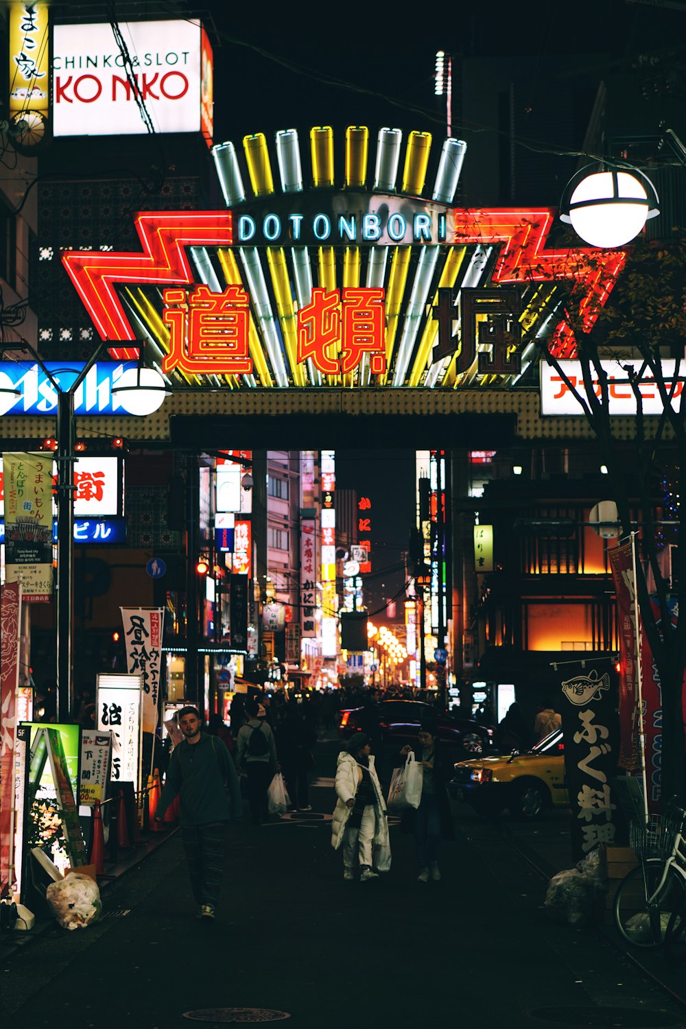 people walking on street during nighttime