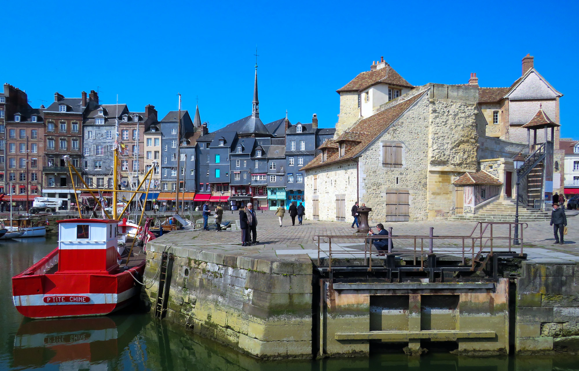 Historic waterfront buildings and boats at Honfleur harbour in Normandy
