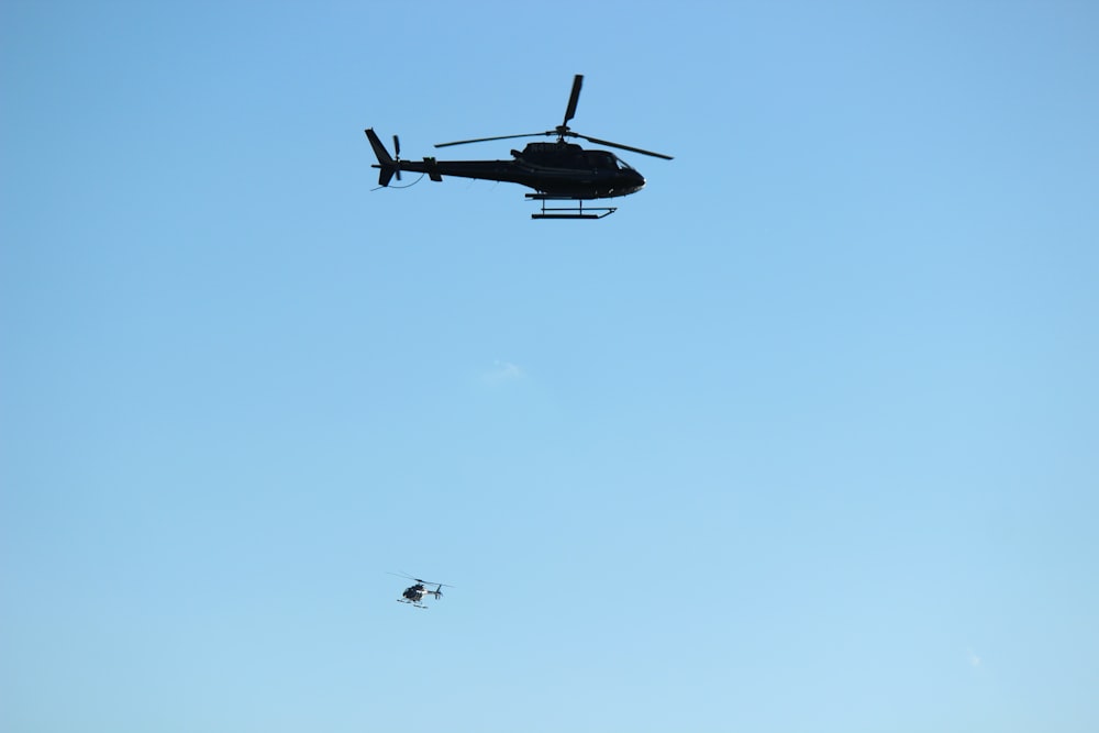 black and white airplane in mid air during daytime