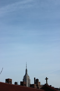 A close-up of a news anchor delivering headlines with a city skyline backdrop