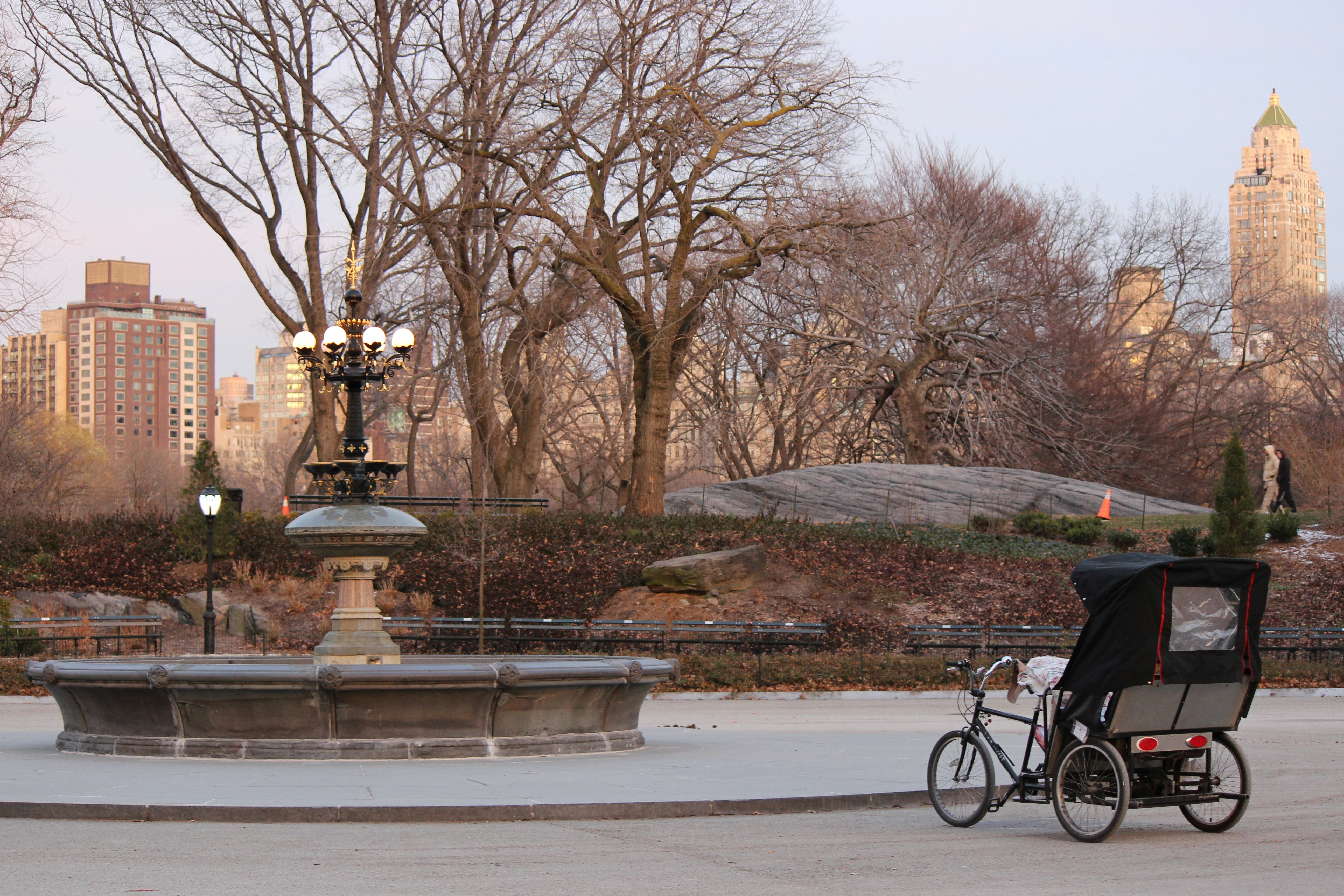 man in black jacket riding bicycle on road during daytime