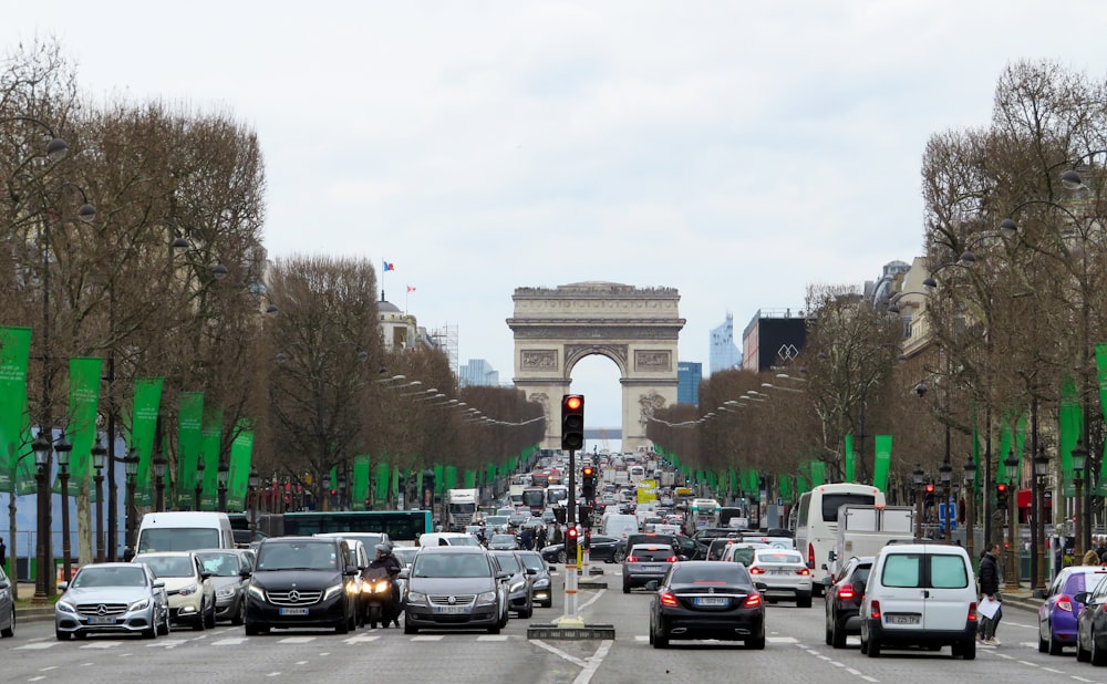 cars parked on road near trees during daytime