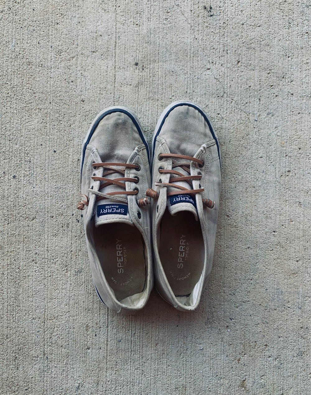 white and brown lace up sneakers