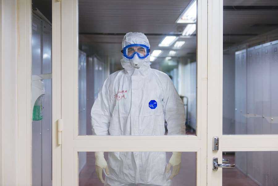 Laboratory worker in full protective equipment including safety goggles and gloves