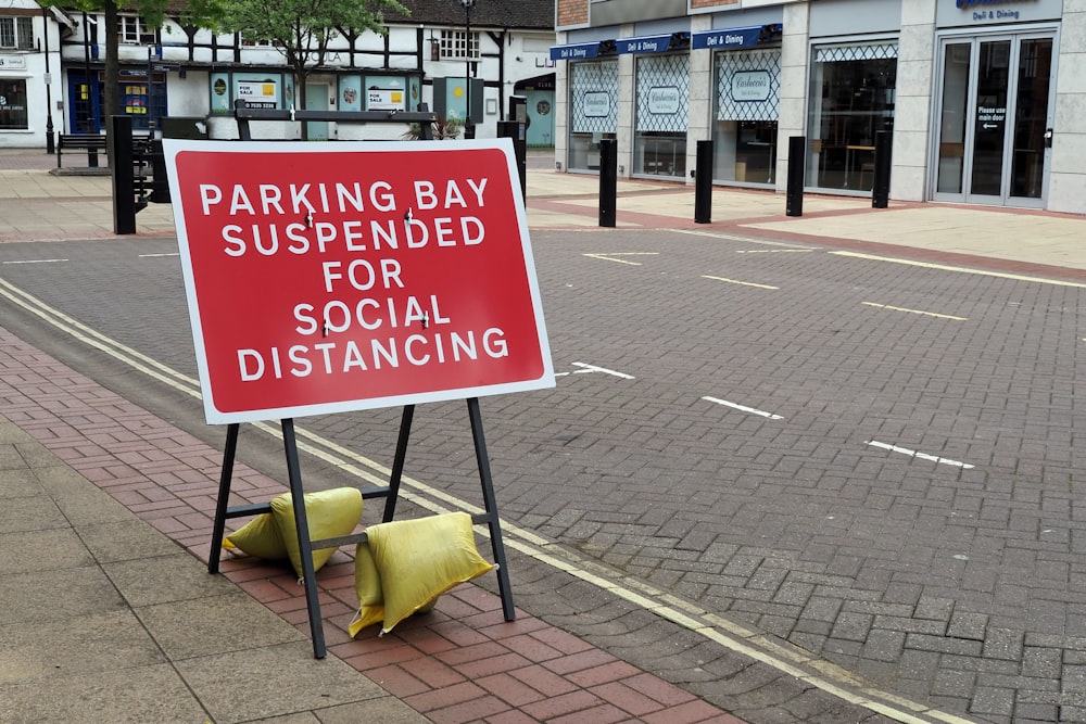 white and black no parking signage