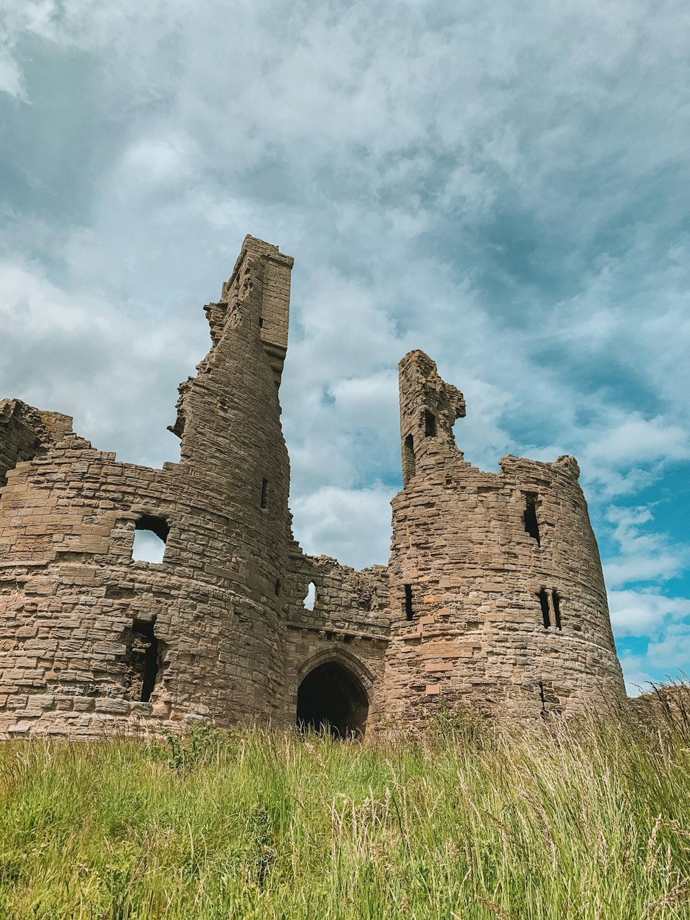 brown concrete castle under cloudy sky