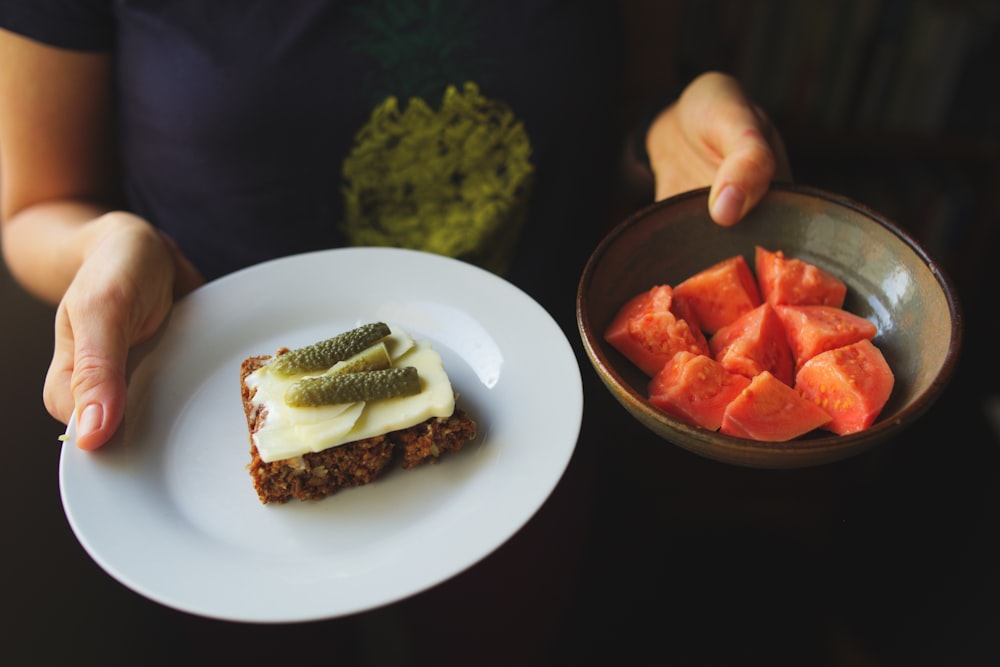 sliced tomato and cucumber on white ceramic plate