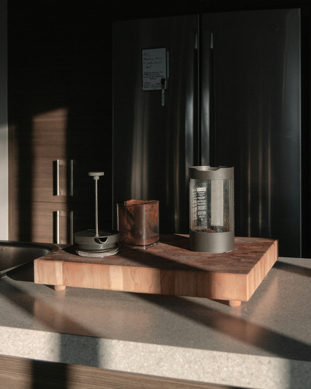 brown wooden table with bottles and drinking glasses