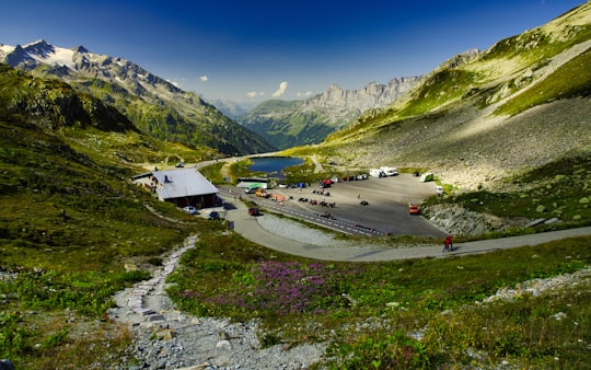 cars on road near mountains during daytime in Susten Pass Switzerland