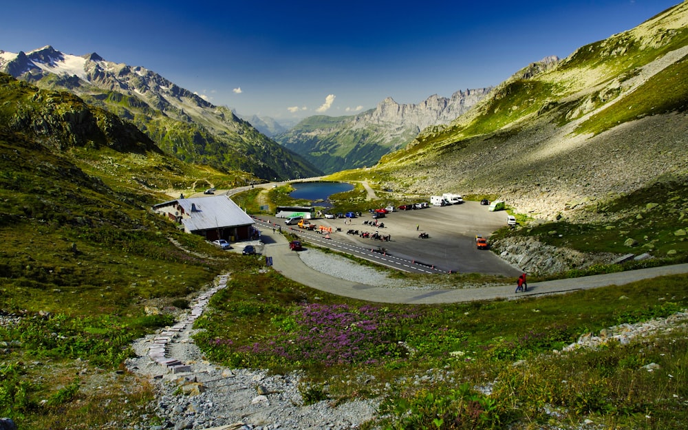 cars on road near mountains during daytime
