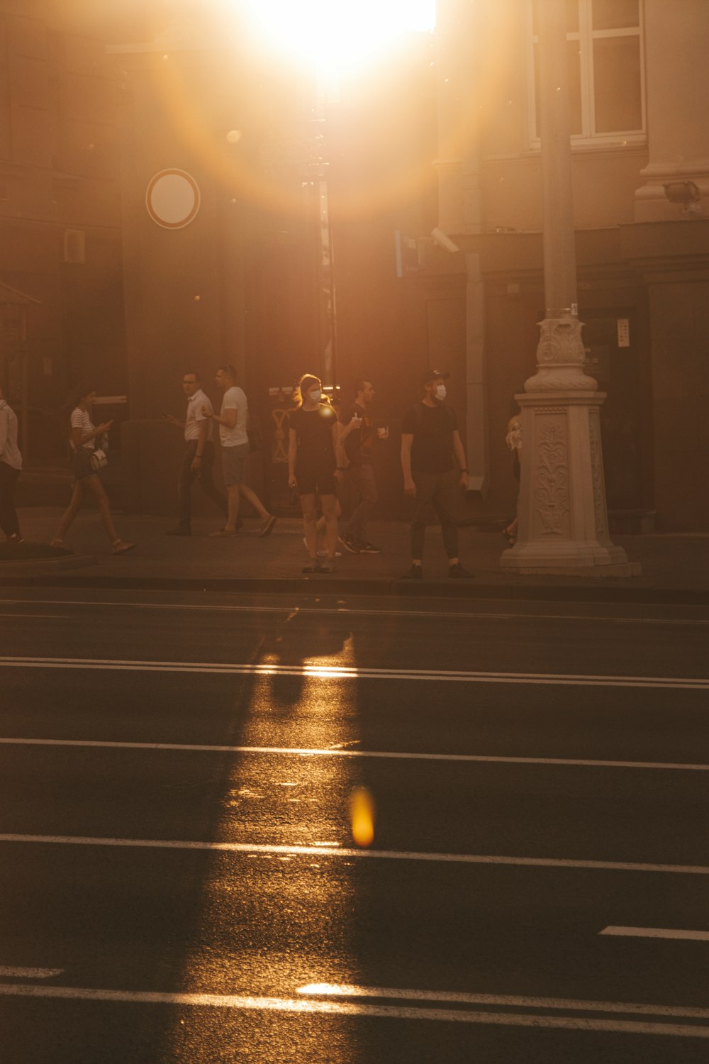 people walking on pedestrian lane during night time