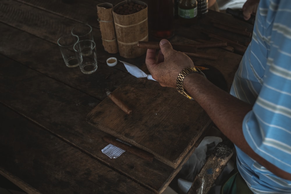 person wearing silver link bracelet watch