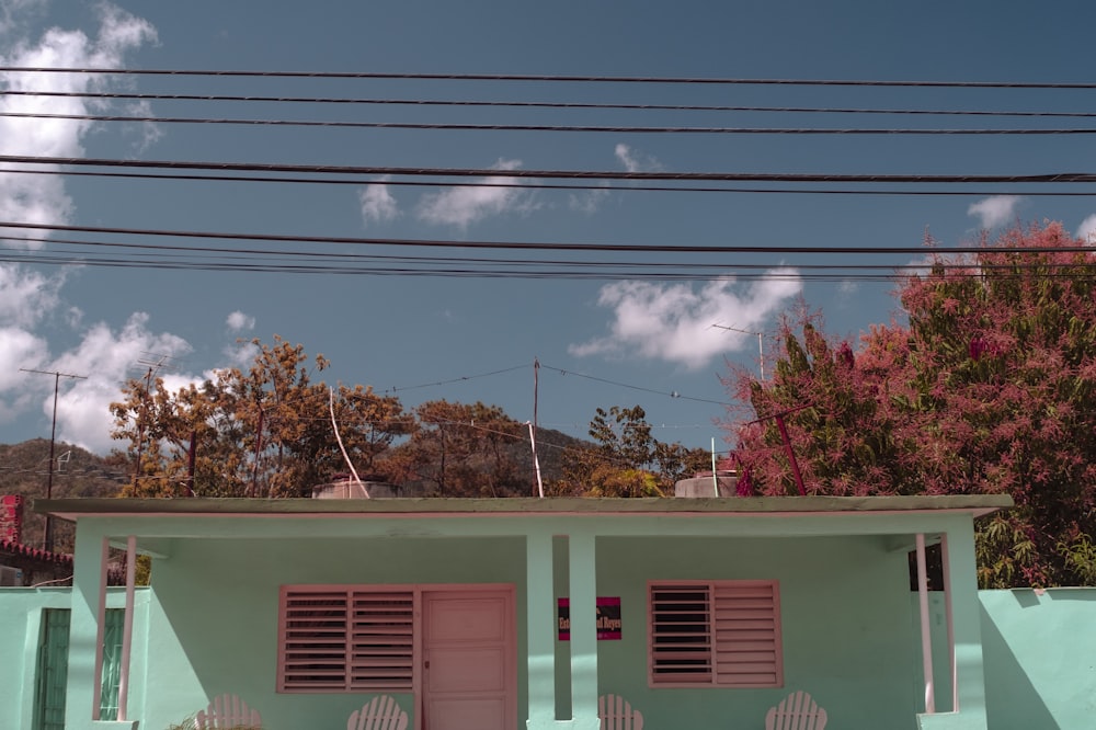 green and white concrete building under blue sky during daytime