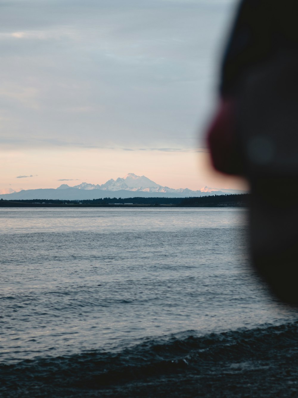 body of water under cloudy sky during daytime