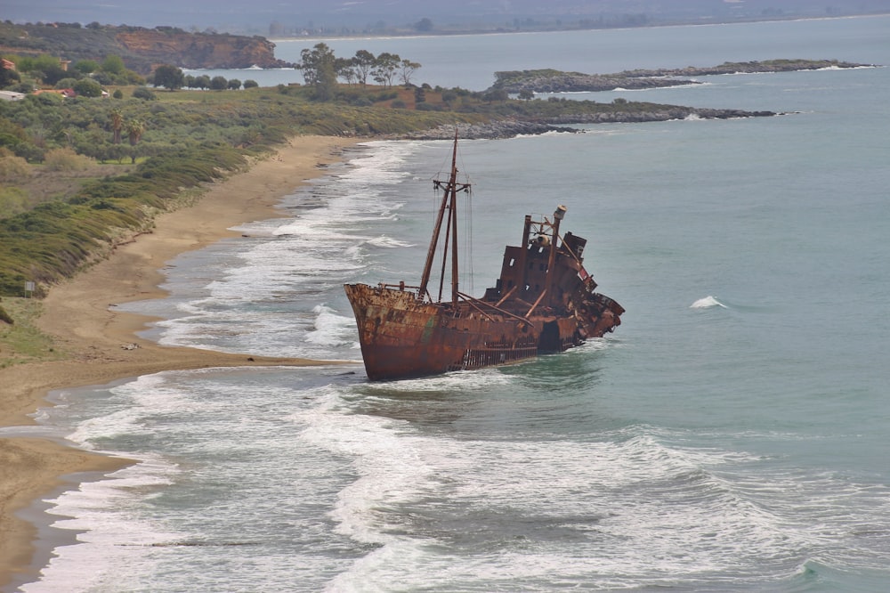 brown ship on sea during daytime