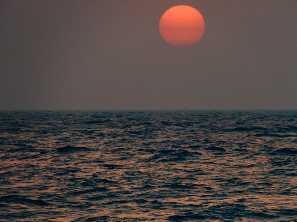 body of water during sunset