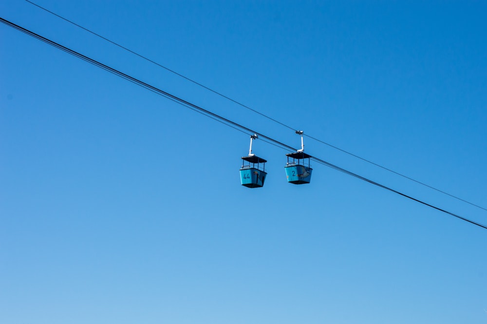 black cable car under blue sky during daytime