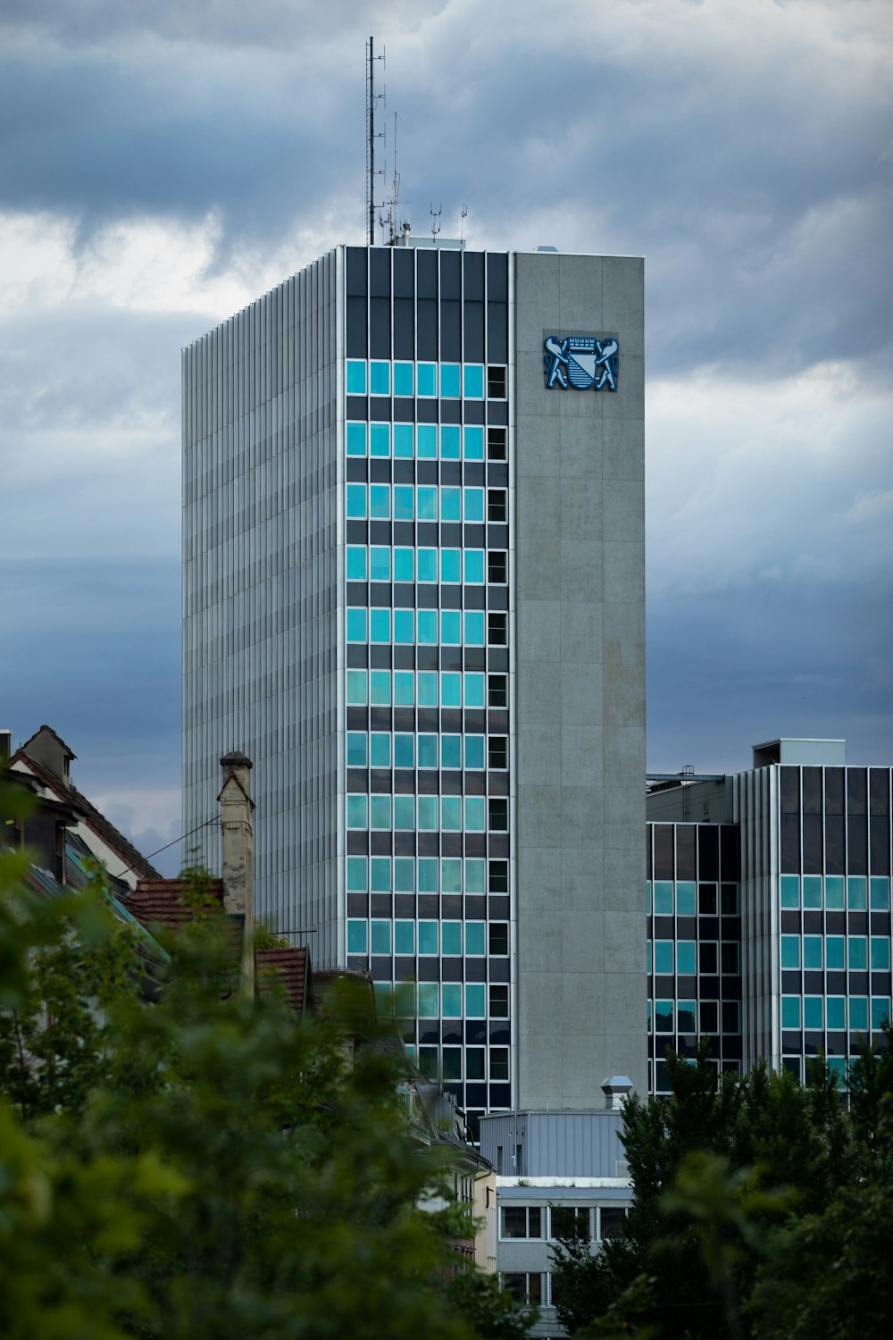 white and blue concrete building under white clouds during daytime