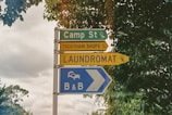 blue and yellow street sign