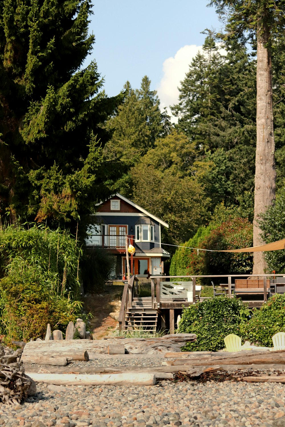 brown wooden house near green trees during daytime