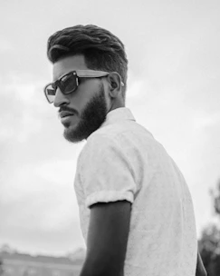 A sleek, modern executive portrait with a confident entrepreneur against a soft, blurred background.