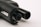 Close-up of the barrel and part of a firearm, focusing on the metal components and details. The surface texture and dark coloration dominate the image.