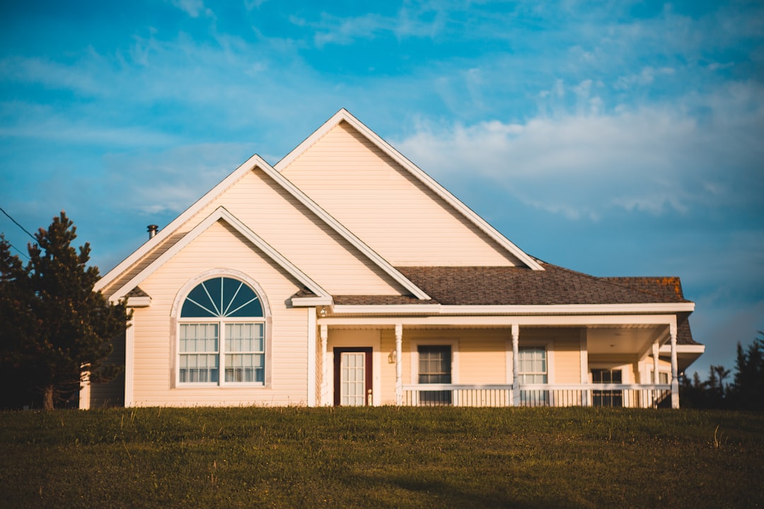 white and gray house under blue sky during daytime