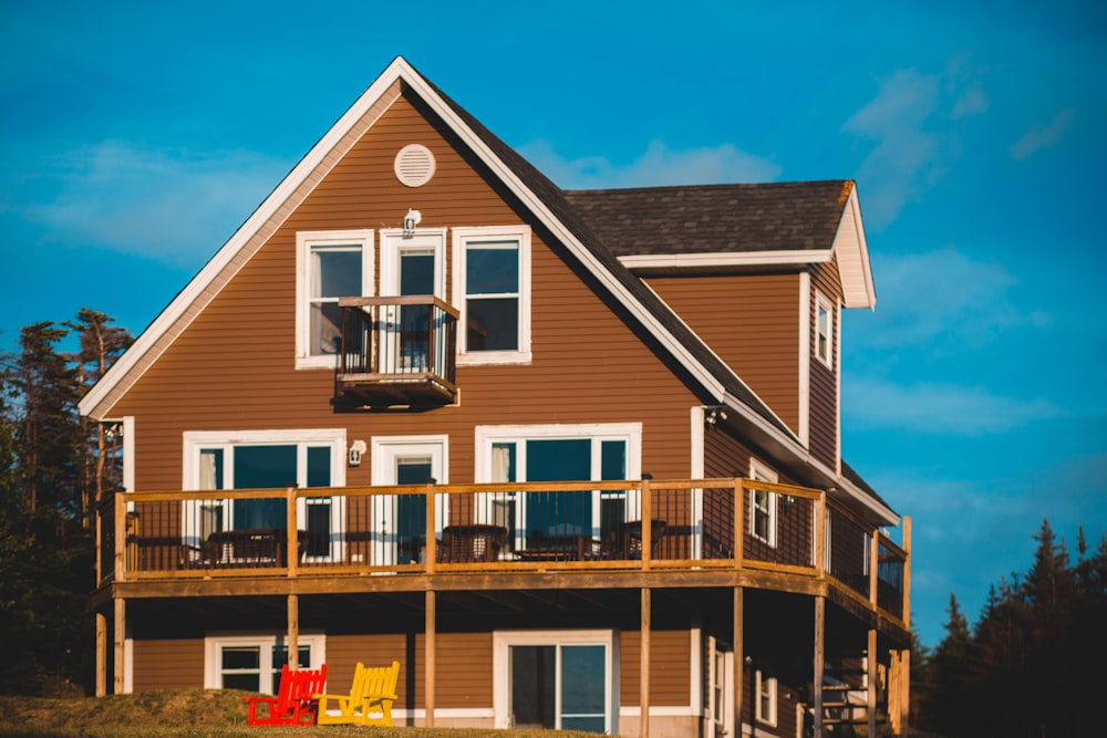 brown and white wooden house under blue sky during daytime