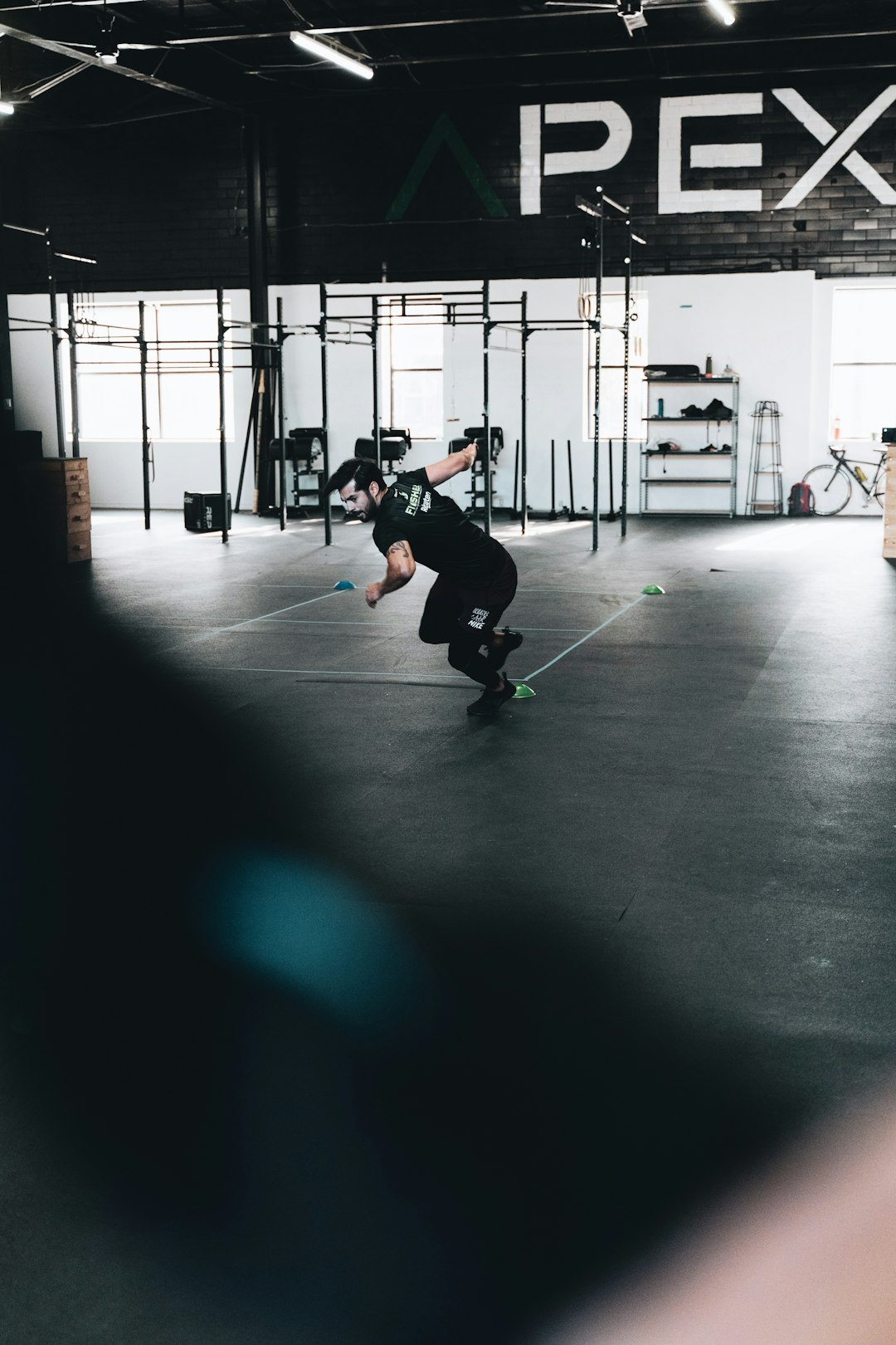 man in black jacket and black pants playing skateboard