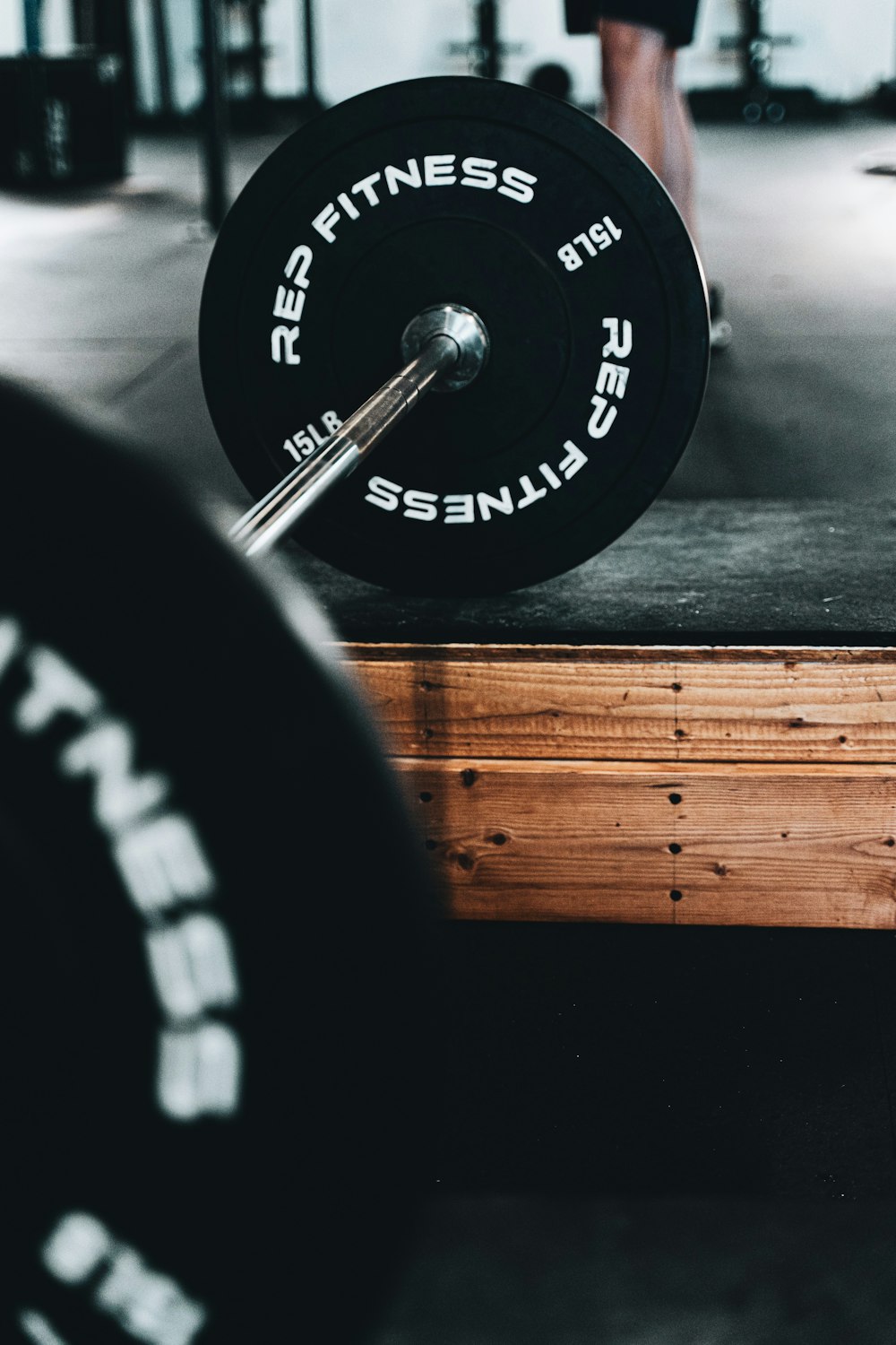 black and silver barbell plate