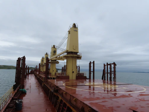 Close-up of a ship's crew coordinating cargo operations on deck at Klaipeda.