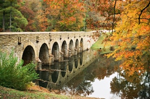 gray concrete bridge over river