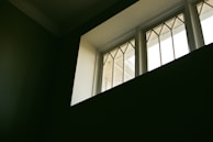 A set of energy-efficient windows fitted neatly into a home's frame, letting in natural light.