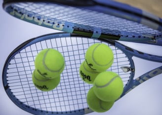 green tennis ball on white net