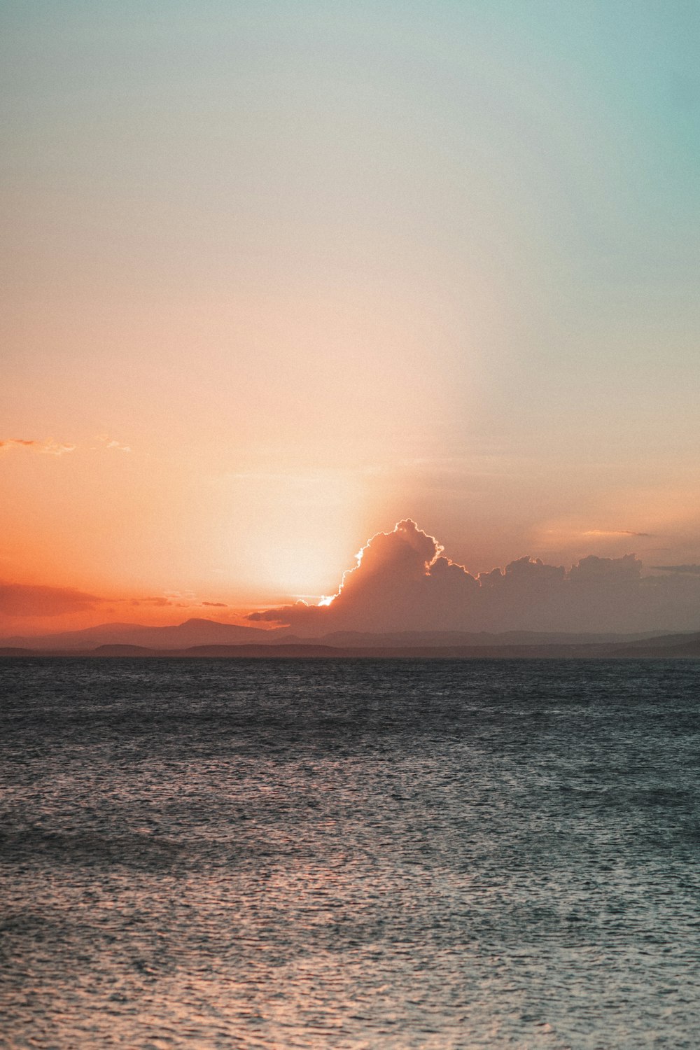 body of water during sunset