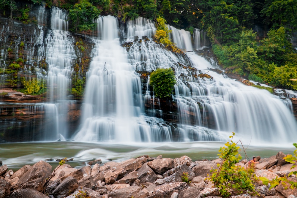 water falls on brown rocky ground