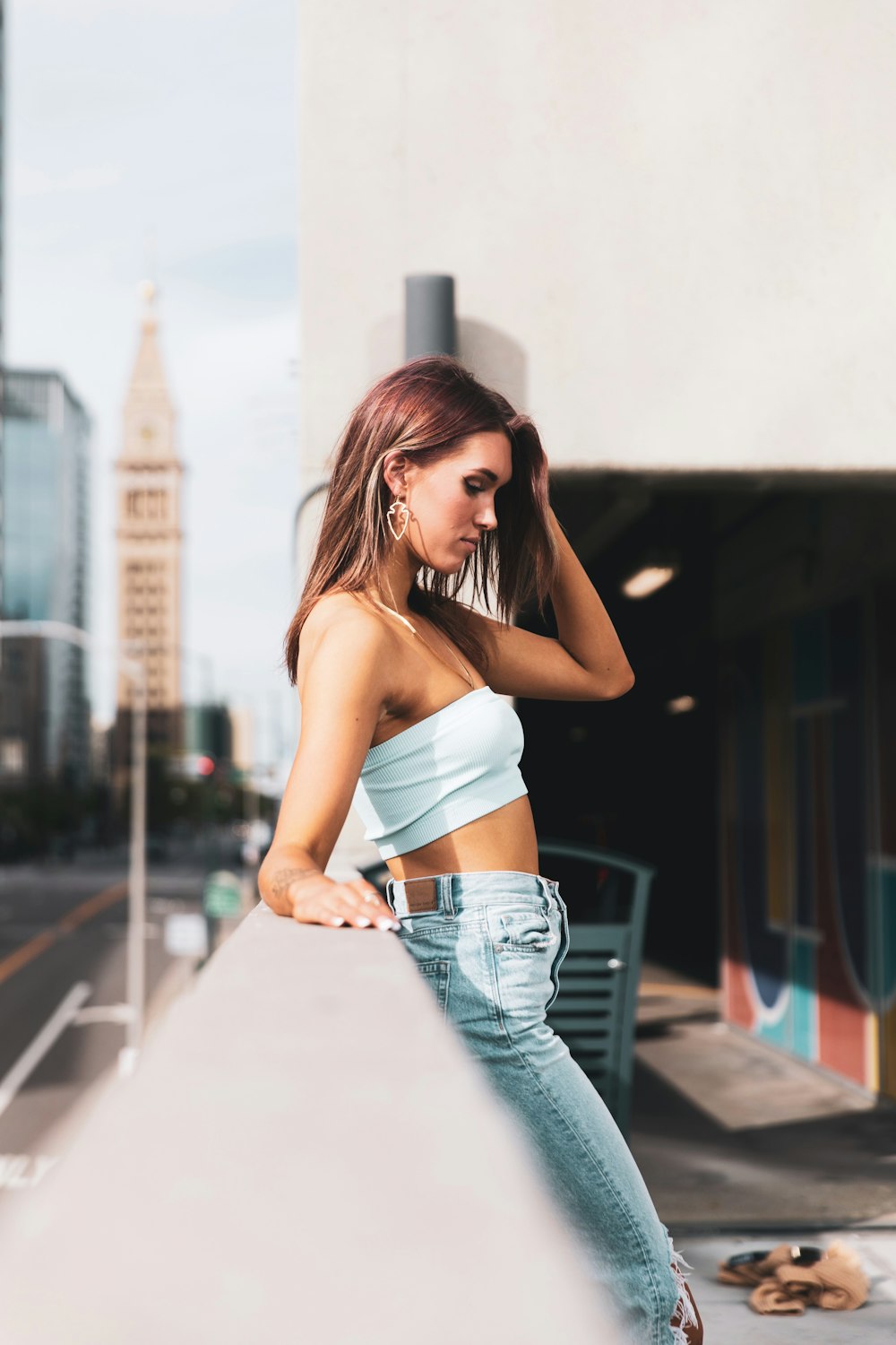 Woman in white sports bra and blue denim jeans photo – Free Grey