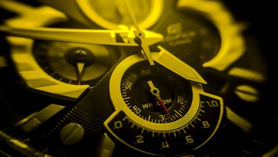 Close-up of a grabbasket clock’s intricate hands and textured face, showcasing fine craftsmanship.