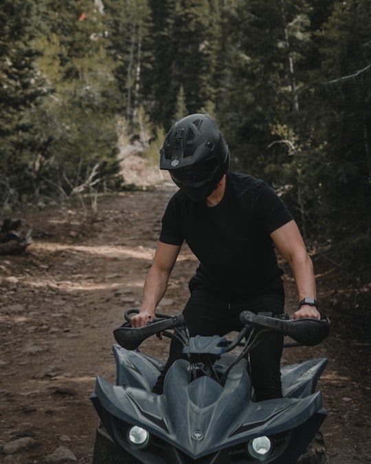 man in black t-shirt riding on bicycle during daytime in Utah United States