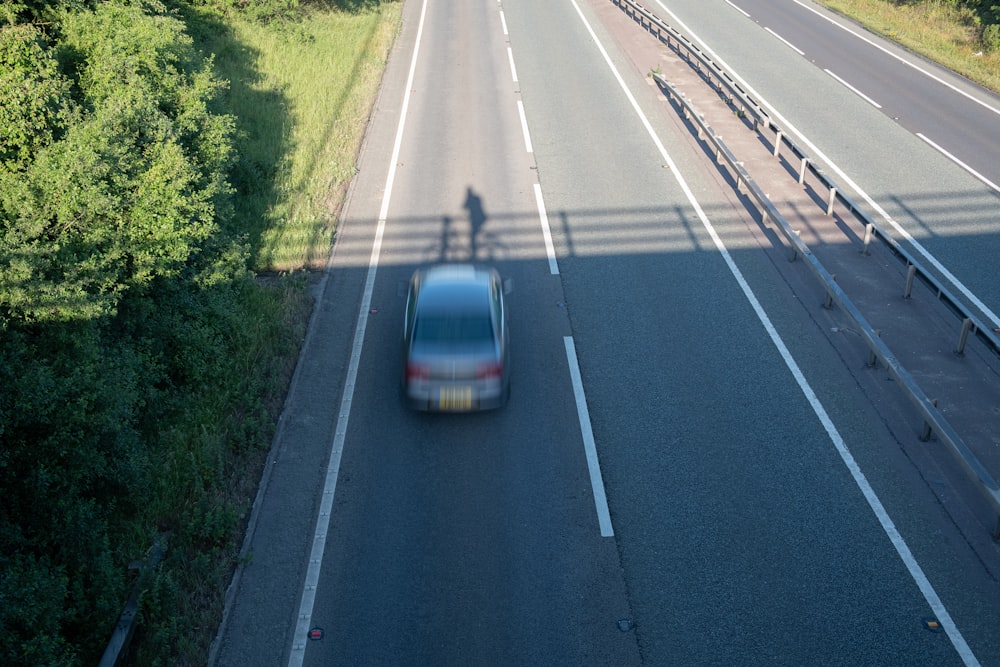 red car on road during daytime