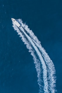 An image of a boat cutting through the water at high speed.