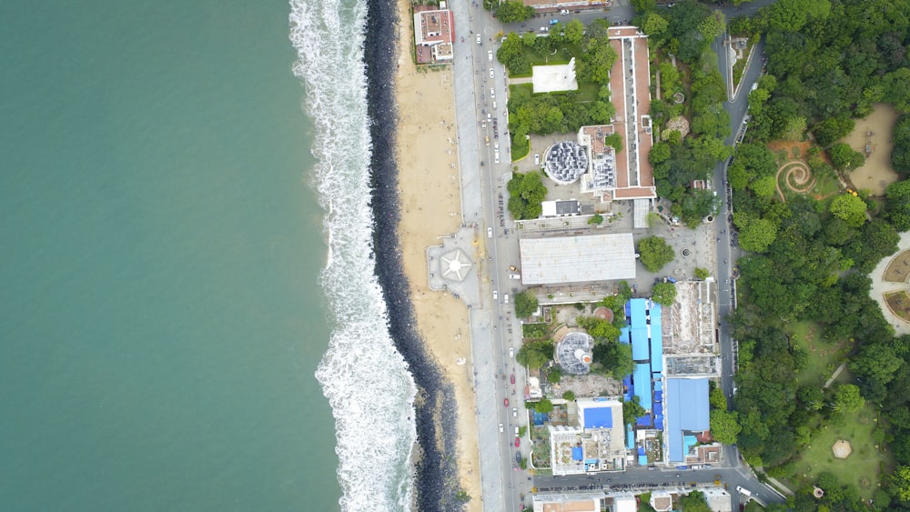 aerial view of city buildings near body of water during daytime