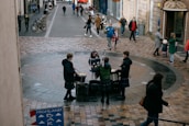 A group of travelers enjoying a traditional Cuban music performance outdoors.